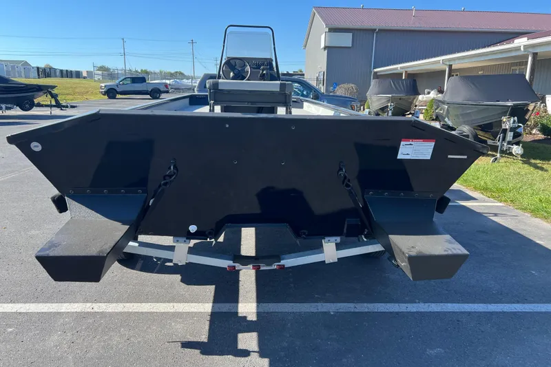 Slide: The Image of 2026 Crestliner 1870 Retriever FCC boat, rear view in a parking lot. - 2