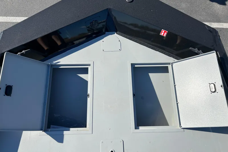 Slide: The Image of 2026 Crestliner 1870 Retriever FCC boat storage compartments open on deck. - 6