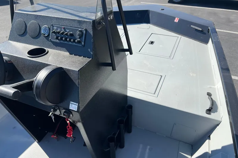 Slide: The Image of 2026 Crestliner 1870 Retriever FCC boat console with controls and storage compartments. - 8