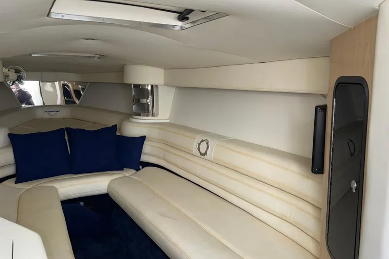 Slide: The Image of Interior of 2010 Fountain 42 Lightning boat with cream seating and blue cushions. - 14