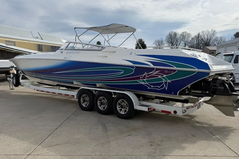 Slide: The Image of 2010 Fountain 42 Lightning speedboat with vibrant graphics on a trailer. - 3