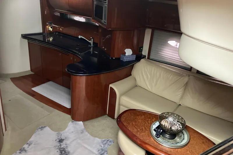 Slide: The Image of Luxurious interior of 2004 Sea Ray 500 Sundancer yacht with elegant kitchen and seating area. - 10