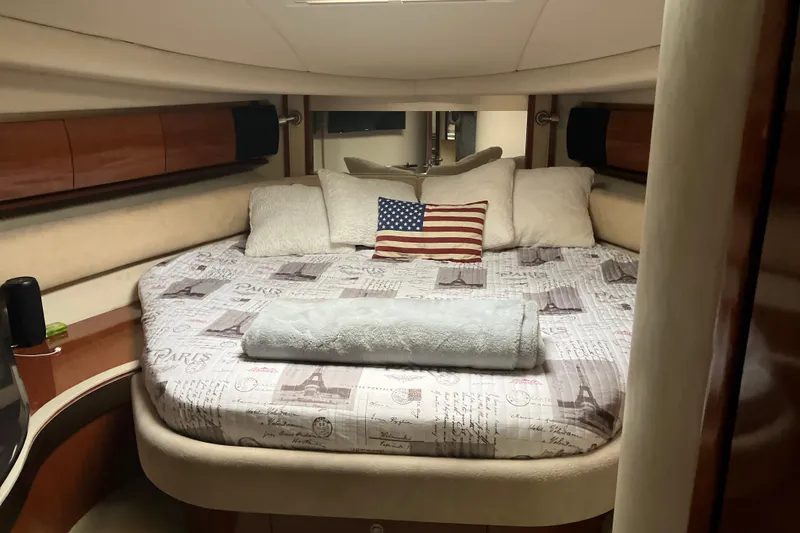 Slide: The Image of Luxurious cabin interior of 2004 Sea Ray 500 Sundancer yacht with cozy bedding. - 14