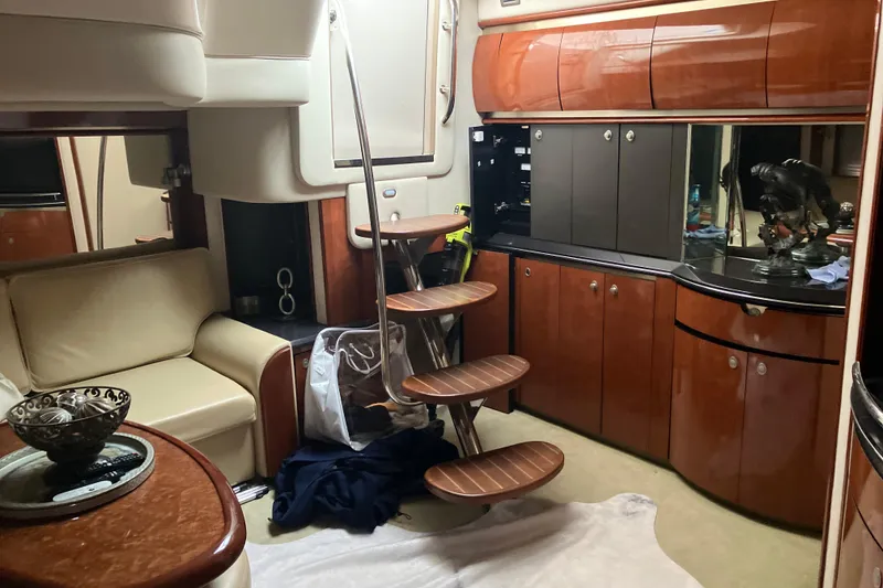 Slide: The Image of Interior of a 2004 Sea Ray 500 Sundancer yacht with elegant wood cabinetry. - 17