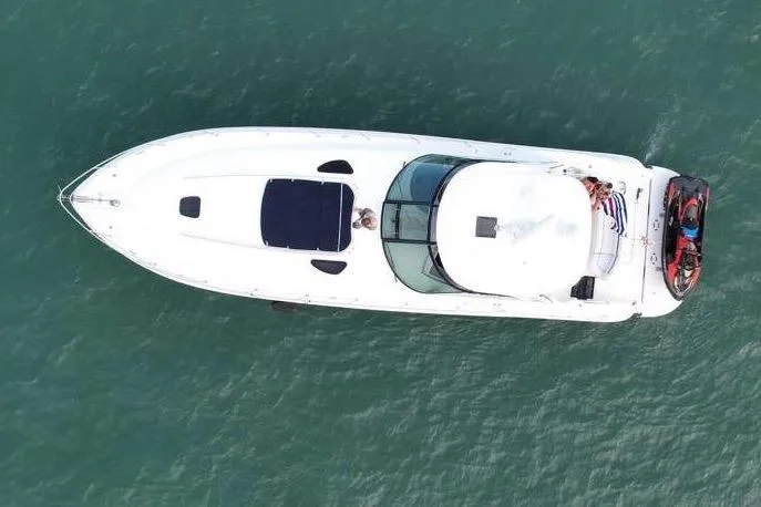 Slide: The Image of Aerial view of 2004 Sea Ray 500 Sundancer yacht on open water. - 2