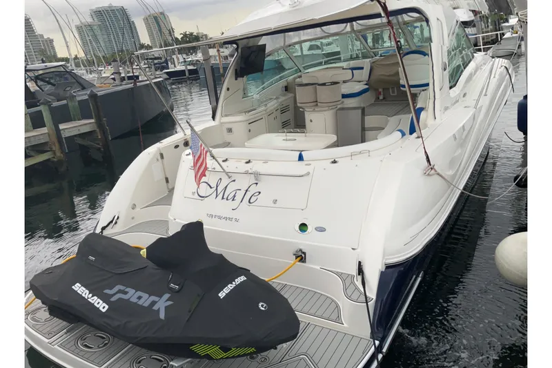 Slide: The Image of 2004 Sea Ray 500 Sundancer docked with Sea-Doo Spark jet ski. - 5