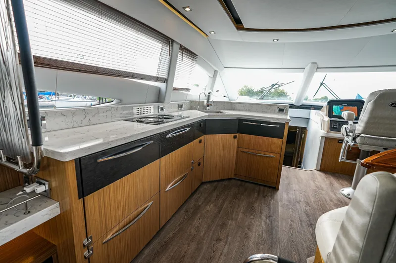 Slide: The Image of Luxurious 2018 Sea Ray L590 Fly yacht interior with modern kitchen and sleek design. - 13
