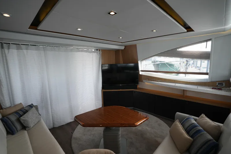 Slide: The Image of Luxurious interior of 2018 Sea Ray L590 Fly yacht with modern furnishings and large windows. - 15