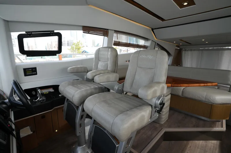 Slide: The Image of Luxurious interior of 2018 Sea Ray L590 Fly yacht with plush seating and modern design. - 19