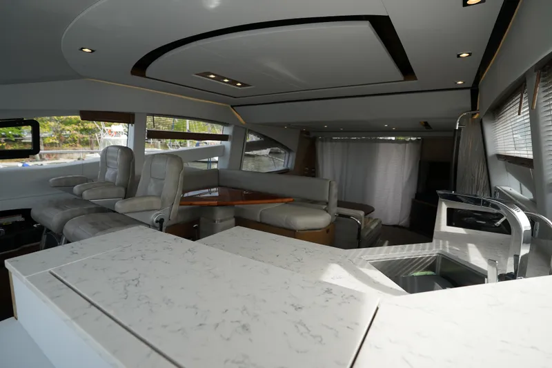 Slide: The Image of Luxurious interior of 2018 Sea Ray L590 Fly yacht with modern seating and sleek design. - 21