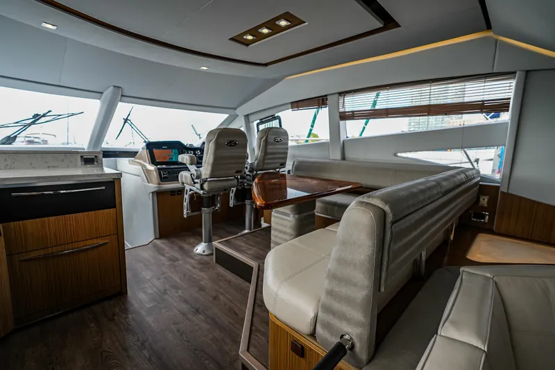 Slide: The Image of Luxurious interior of 2018 Sea Ray L590 Fly yacht with modern seating and helm. - 22