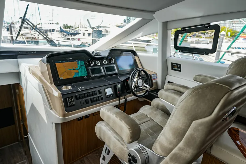 Slide: The Image of Luxurious helm of 2018 Sea Ray L590 Fly yacht with advanced navigation systems. - 24