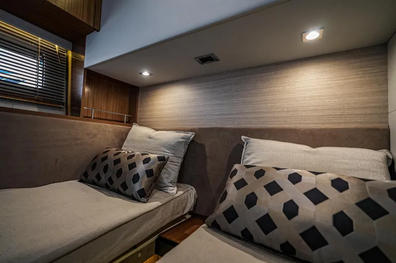 Slide: The Image of Luxurious cabin interior of 2018 Sea Ray L590 Fly yacht with modern bedding and lighting. - 29