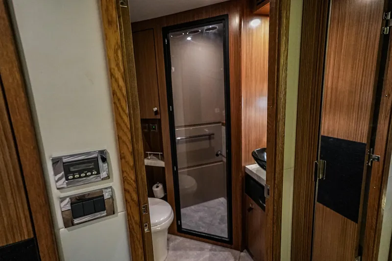 Slide: The Image of Luxurious bathroom interior of 2018 Sea Ray L590 Fly yacht with modern amenities. - 32
