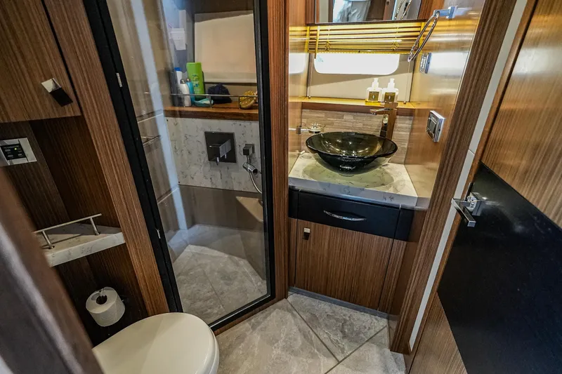 Slide: The Image of Luxurious bathroom in 2018 Sea Ray L590 Fly yacht with modern fixtures and elegant design. - 33