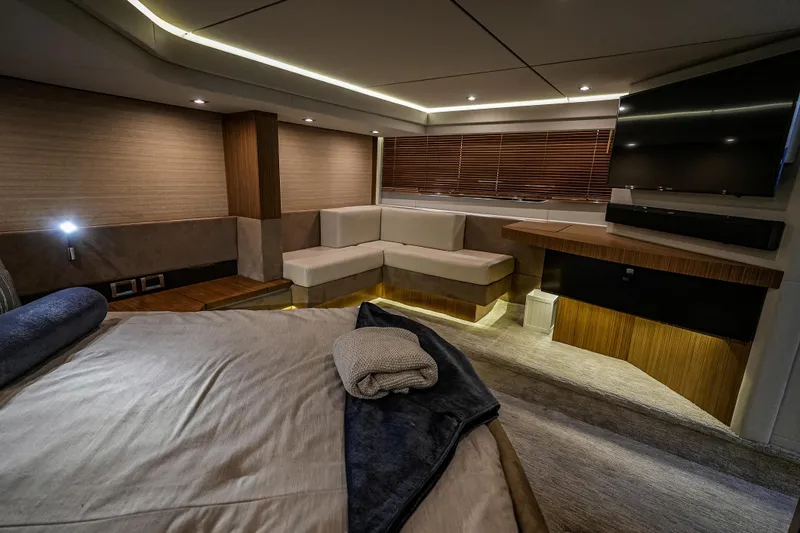Slide: The Image of Luxurious interior of 2018 Sea Ray L590 Fly yacht with modern furnishings and ambient lighting. - 35
