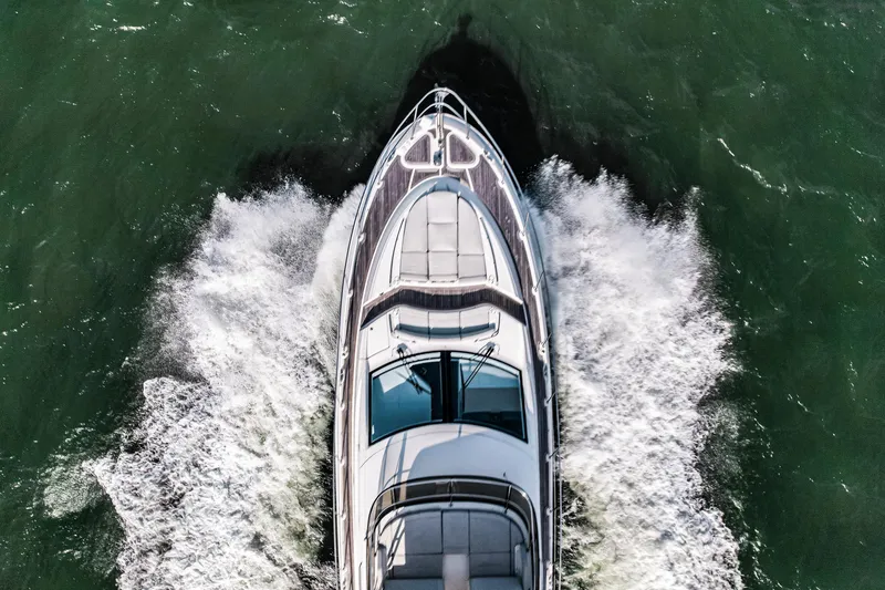 Slide: The Image of Aerial view of 2018 Sea Ray L590 Fly yacht cruising through water. - 4