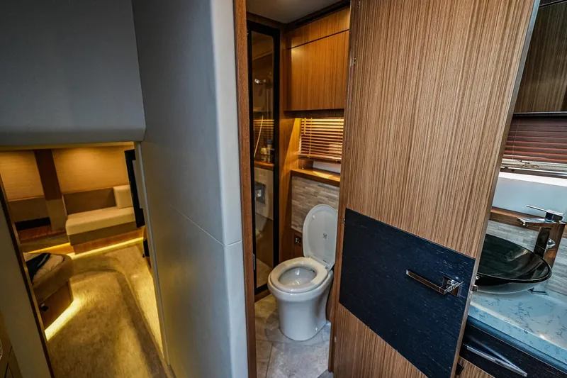 Slide: The Image of Luxurious 2018 Sea Ray L590 Fly yacht interior with modern bathroom and cozy cabin. - 40