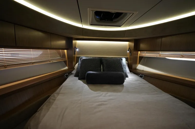 Slide: The Image of Luxurious 2018 Sea Ray L590 Fly yacht bedroom with elegant lighting and modern design. - 43