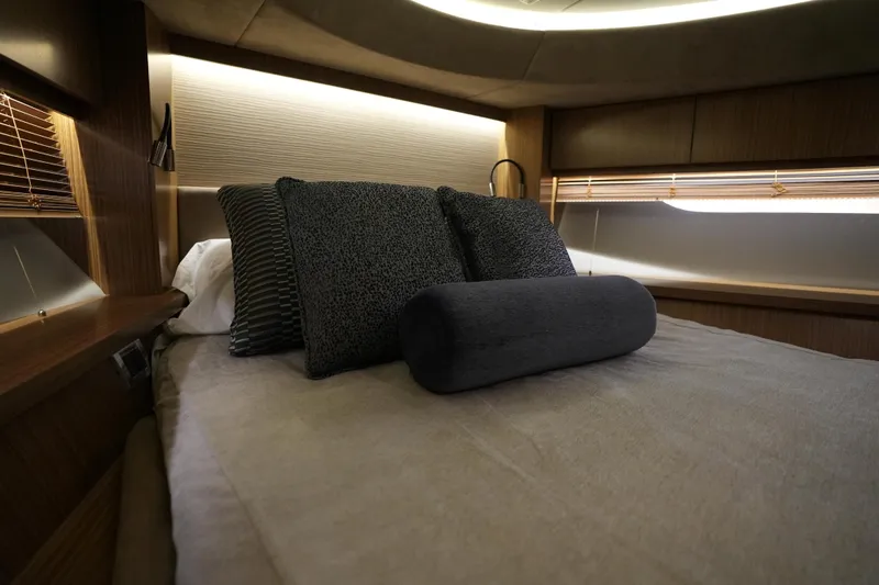 Slide: The Image of Luxurious bedroom interior of 2018 Sea Ray L590 Fly yacht with elegant bedding. - 45