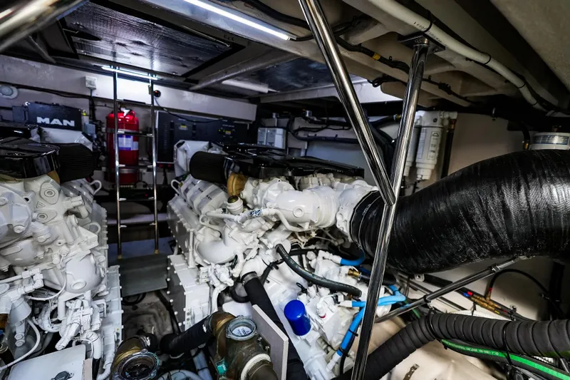 Slide: The Image of Engine room of 2018 Sea Ray L590 Fly yacht, featuring dual MAN engines. - 61