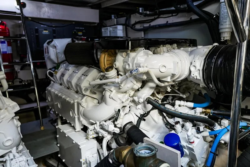 Slide: The Image of Engine room of 2018 Sea Ray L590 Fly yacht, showcasing powerful machinery and components. - 63
