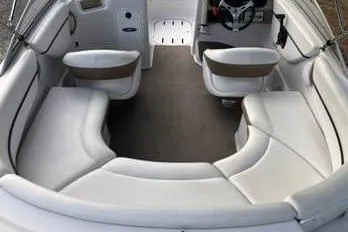 Slide: The Image of 2007 Four Winns 204 Funship boat interior with white seating and steering wheel. - 8