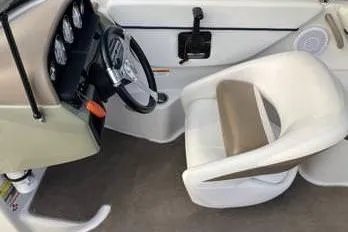 Slide: The Image of 2007 Four Winns 204 Funship boat interior with steering wheel and seating. - 9