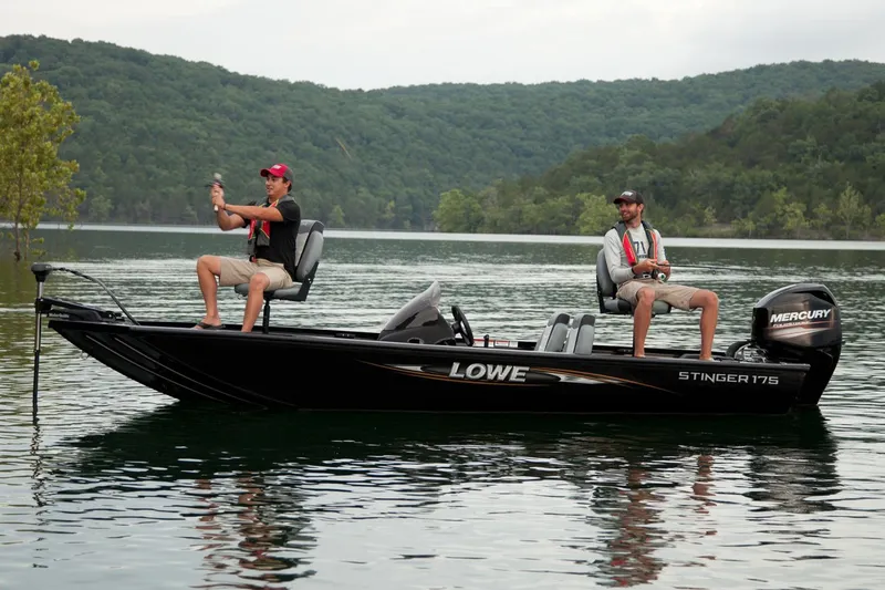 Slide: The Image of Manufacturer Provided Image: 2016 Lowe Stinger 175 fishing boat on a lake with two people fishing. - 11