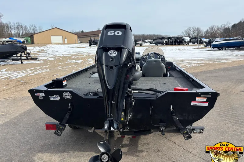 Slide: The Image of 2016 Lowe Stinger 175 boat with 60 HP motor in snowy outdoor setting. - 2