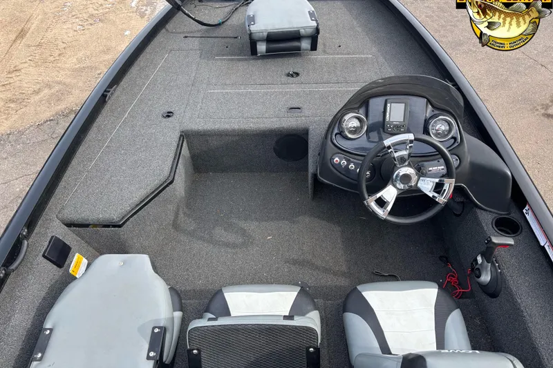 Slide: The Image of 2016 Lowe Stinger 175 boat interior with steering console and seating. - 4