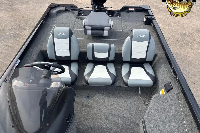 Slide: The Image of 2016 Lowe Stinger 175 boat interior with three seats and steering console. - 6