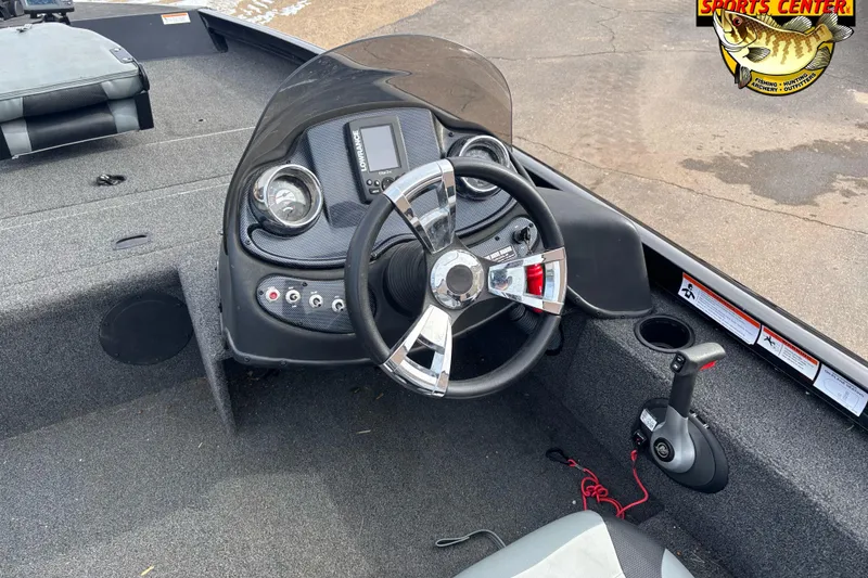 Slide: The Image of 2016 Lowe Stinger 175 boat dashboard with steering wheel and control panel. - 7