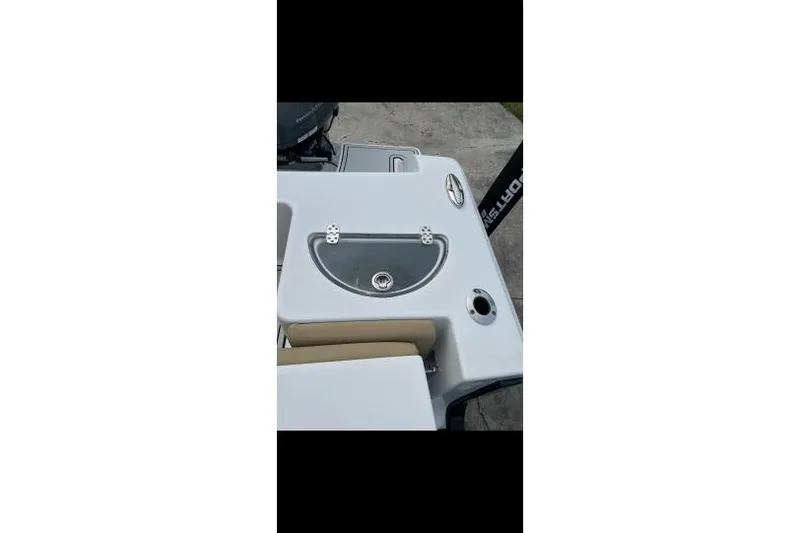 Slide: The Image of 2017 Sportsman Open 252 Center Console boat deck with storage compartment. - 10