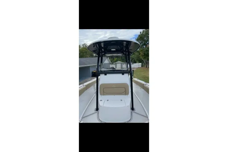 Slide: The Image of 2017 Sportsman Open 252 Center Console boat, front view, outdoors. - 6