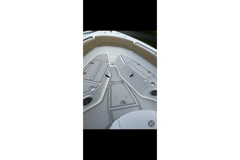 Slide: The Image of 2017 Sportsman Open 252 Center Console boat deck with storage compartments. - 9