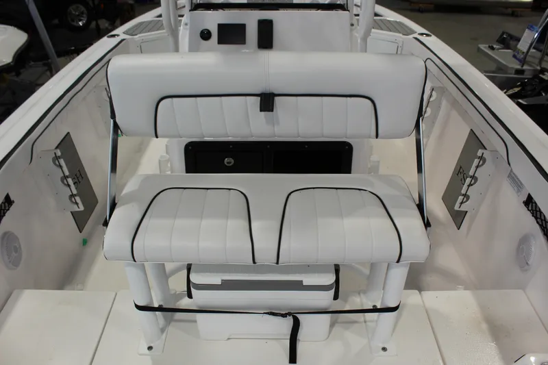 Slide: The Image of 2025 Yamaha Boats 222 FSH Sport interior seating, featuring white cushioned seats and sleek design. - 3