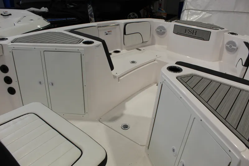 Slide: The Image of 2025 Yamaha Boats 222 FSH Sport interior with seating and storage compartments. - 8