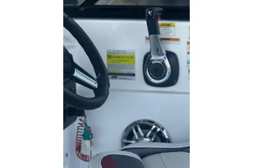 Slide: The Image of 2023 Hurricane SunDeck Sport 188 OB boat dashboard with steering wheel and controls. - 7