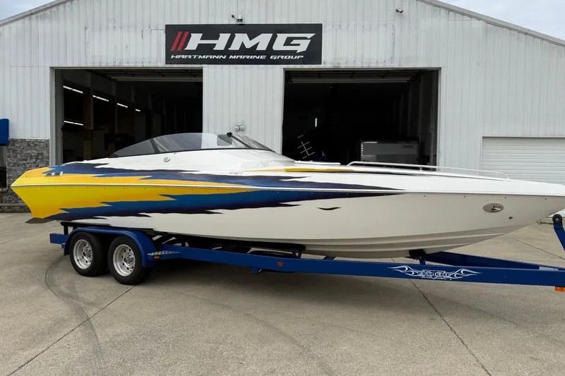 The Image of 2004 Eliminator 280 Eagle XP boat on trailer outside Hartmann Marine Group. - 1