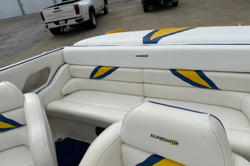 Slide: The Image of 2004 Eliminator 280 Eagle XP boat interior with white and blue-yellow accents. - 9