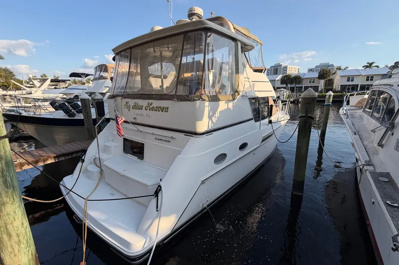 Slide: The Image of 2000 Carver 356 Aft Cabin Motor Yacht docked in a marina, sunny day. - 0