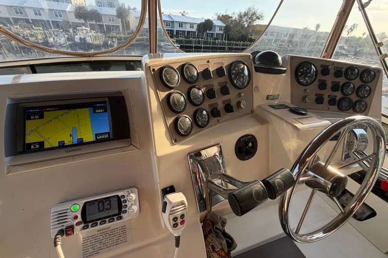 Slide: The Image of Helm of 2000 Carver 356 Aft Cabin Motor Yacht with navigation and control instruments. - 12