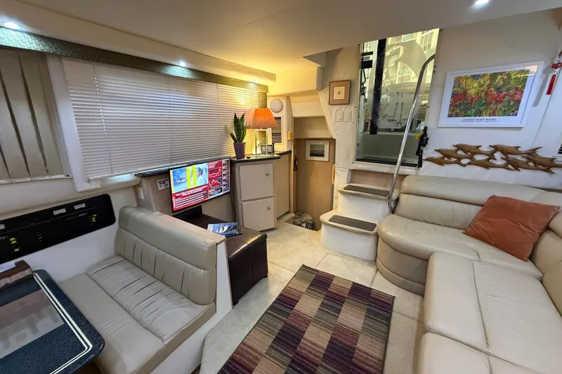 Slide: The Image of Interior of 2000 Carver 356 Aft Cabin Motor Yacht with cozy seating and modern decor. - 18