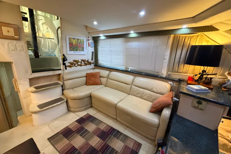 Slide: The Image of Luxurious interior of 2000 Carver 356 Aft Cabin Motor Yacht with cozy seating area. - 19
