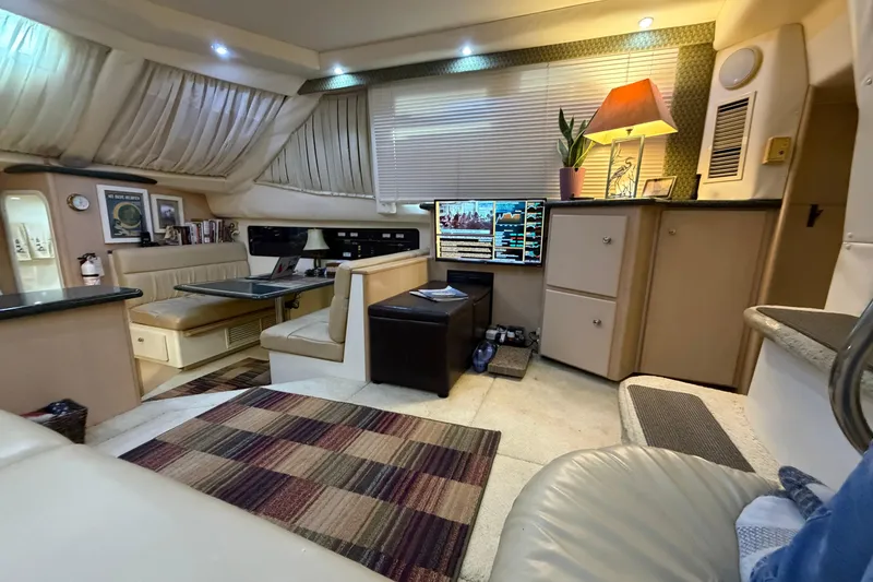 Slide: The Image of Interior of 2000 Carver 356 Aft Cabin Motor Yacht, featuring cozy seating and modern amenities. - 20