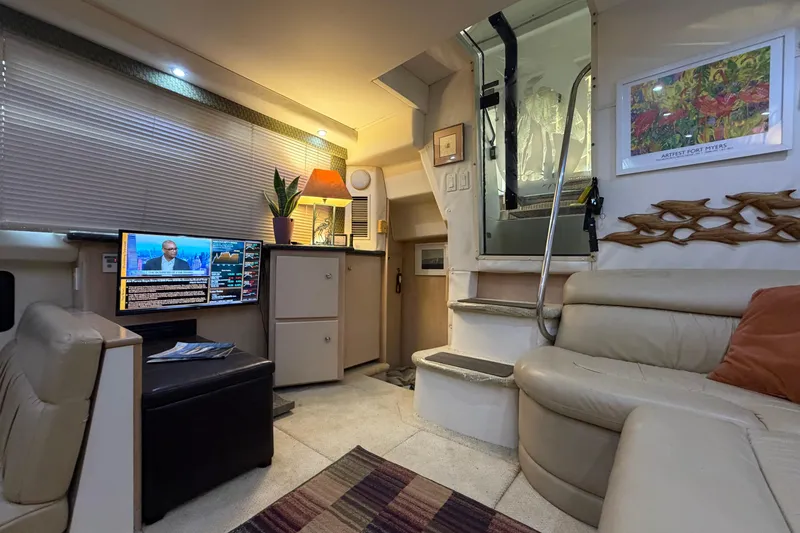 Slide: The Image of Interior of 2000 Carver 356 Aft Cabin Motor Yacht with cozy seating and modern amenities. - 21
