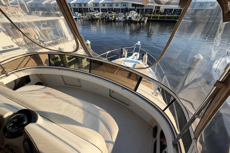 Slide: The Image of 2000 Carver 356 Aft Cabin Motor Yacht interior with marina view. - 7