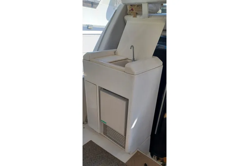 Slide: The Image of Carver 356 Aft Cabin Motor Yacht 2000, onboard sink and storage area. - 11