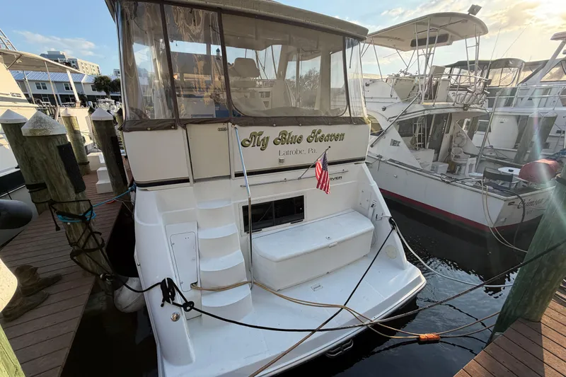 Slide: The Image of Carver 356 Aft Cabin Motor Yacht 2000 docked, featuring "My Blue Heaven" nameplate. - 2